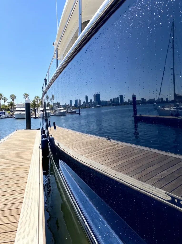 Ceramic coated navy boat hull with glossy water-beading finish, boat detailing in O'Connor WA