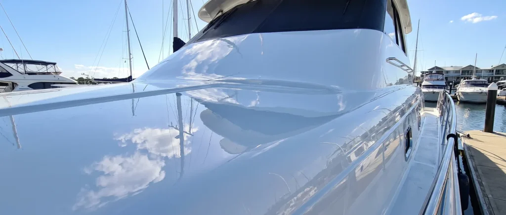 Ceramic coating on a gleaming white boat hull detailed in O'Connor WA, mirror-gloss finished result