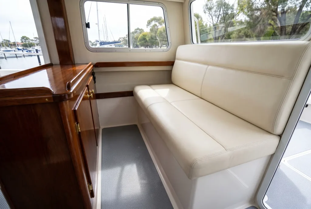 Spotless detailed boat cabin interior with clean vinyl seating and polished console in O'Connor