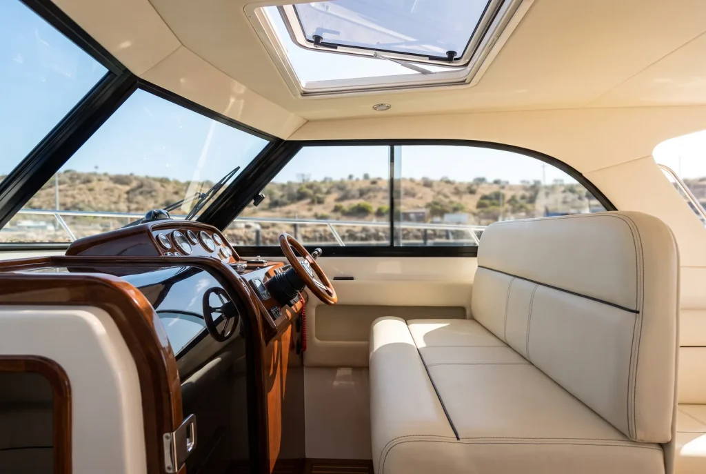 Spotless detailed boat cabin interior with clean vinyl seats and polished console in O'Connor