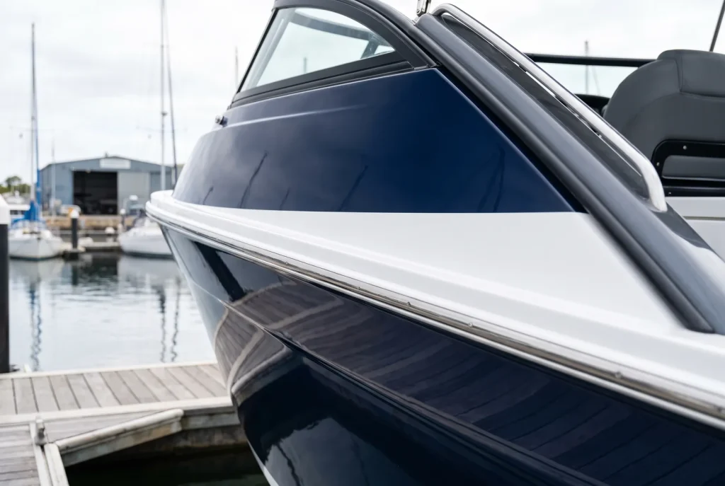 Paint correction edge and seam detail on a glossy boat hull, boat detailing in O'Connor WA